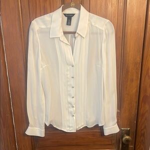 White House Black Market White Silk Long Sleeve Shirt with silver accents.